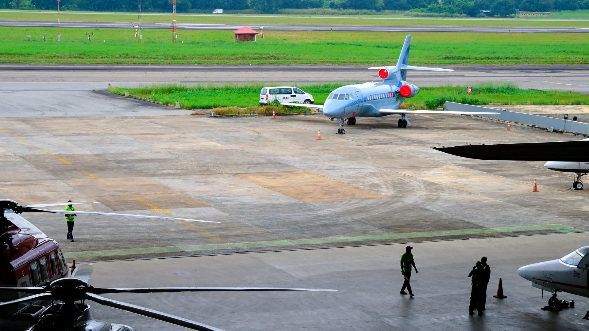 Private jet on runway approaching city skyline
